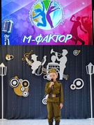 Участие в районном музыкальном фестивале "М- фактор" учащегося 2 "А" класса Маринина Михаила