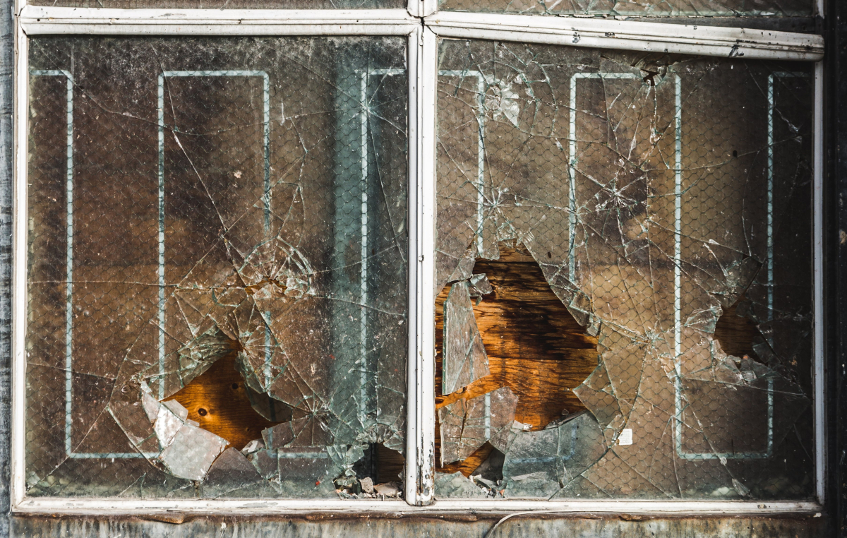 broken-shards-of-glass-hanging-in-a-boarded-up-window.jpg broken-shards-of-glass-hanging-in-a-boarded-up-window.jpg