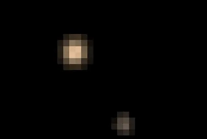 NASA представило первые цветные изображения Плутона и его спутника